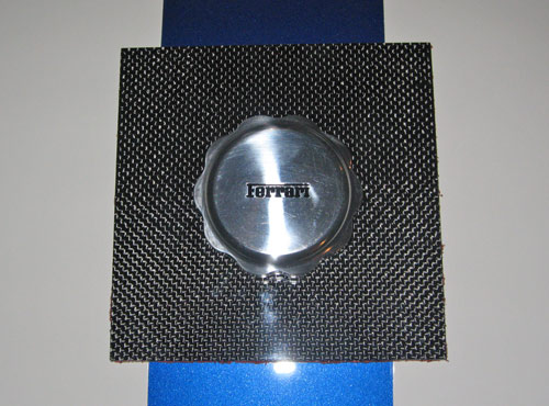 Carbon fiber Ferrari gas cap paperweight