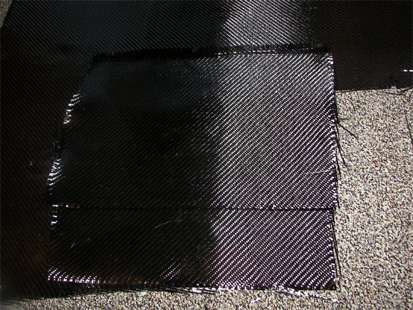 Two squares of carbon fiber